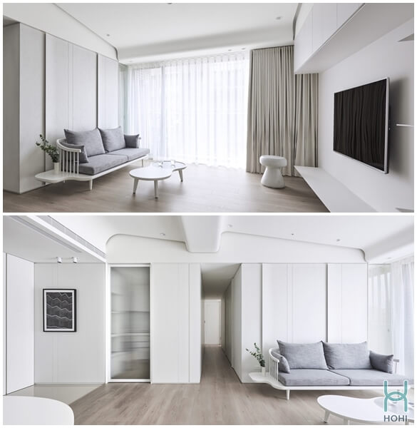 phòng khách nhà chung cư phong cách tối giản màu trắng, nền vân gỗ.